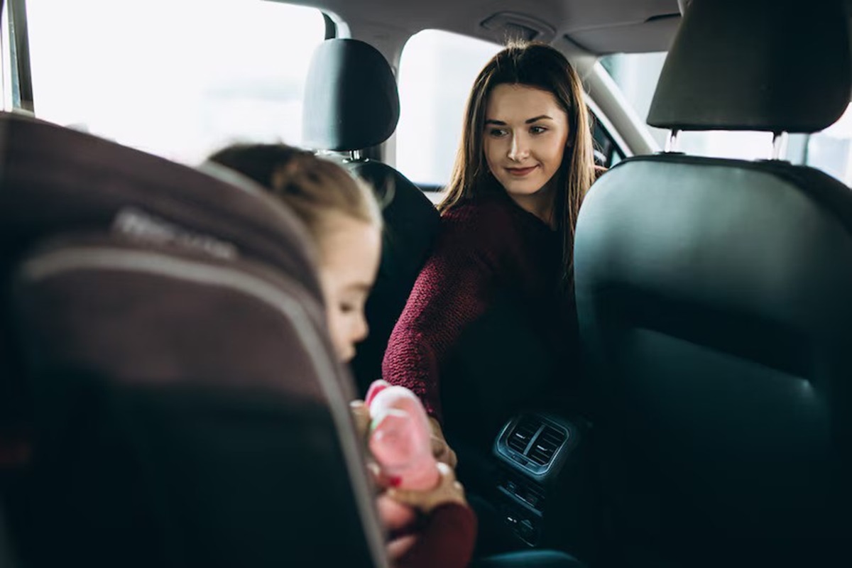 rear facing child restraint system shields and moves together with the infant