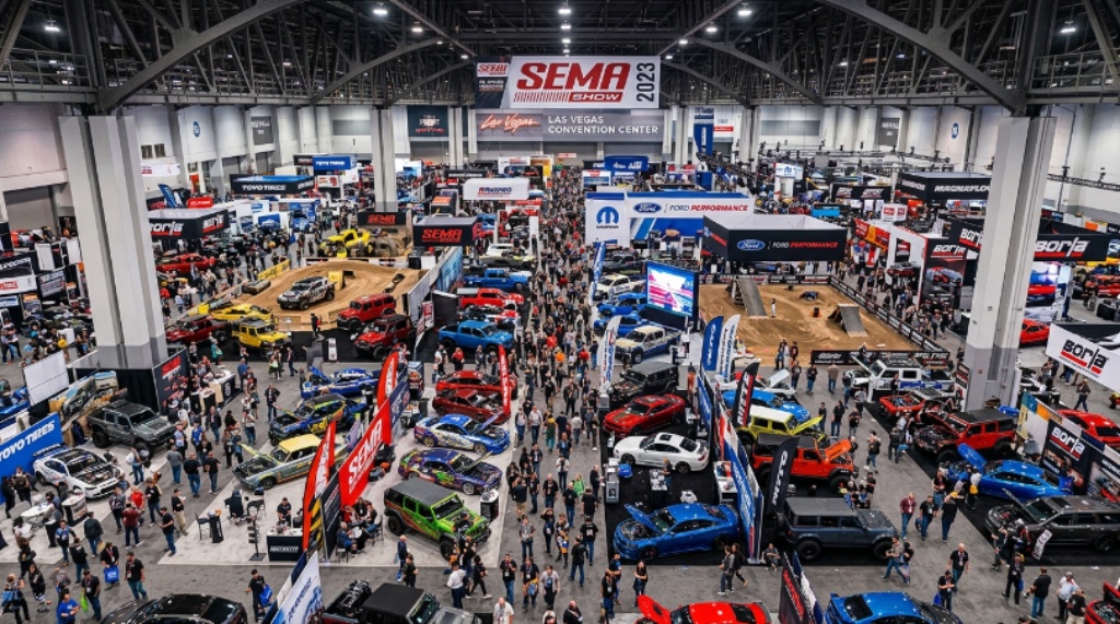 Aerial view of the SEMA Show floor at the Las Vegas Convention Center packed with automotive exhibitors and visitors