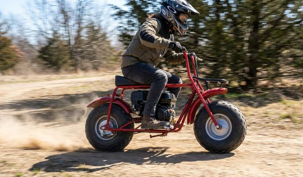 1. Coleman CT200U mini bike performance testing on a flat surface